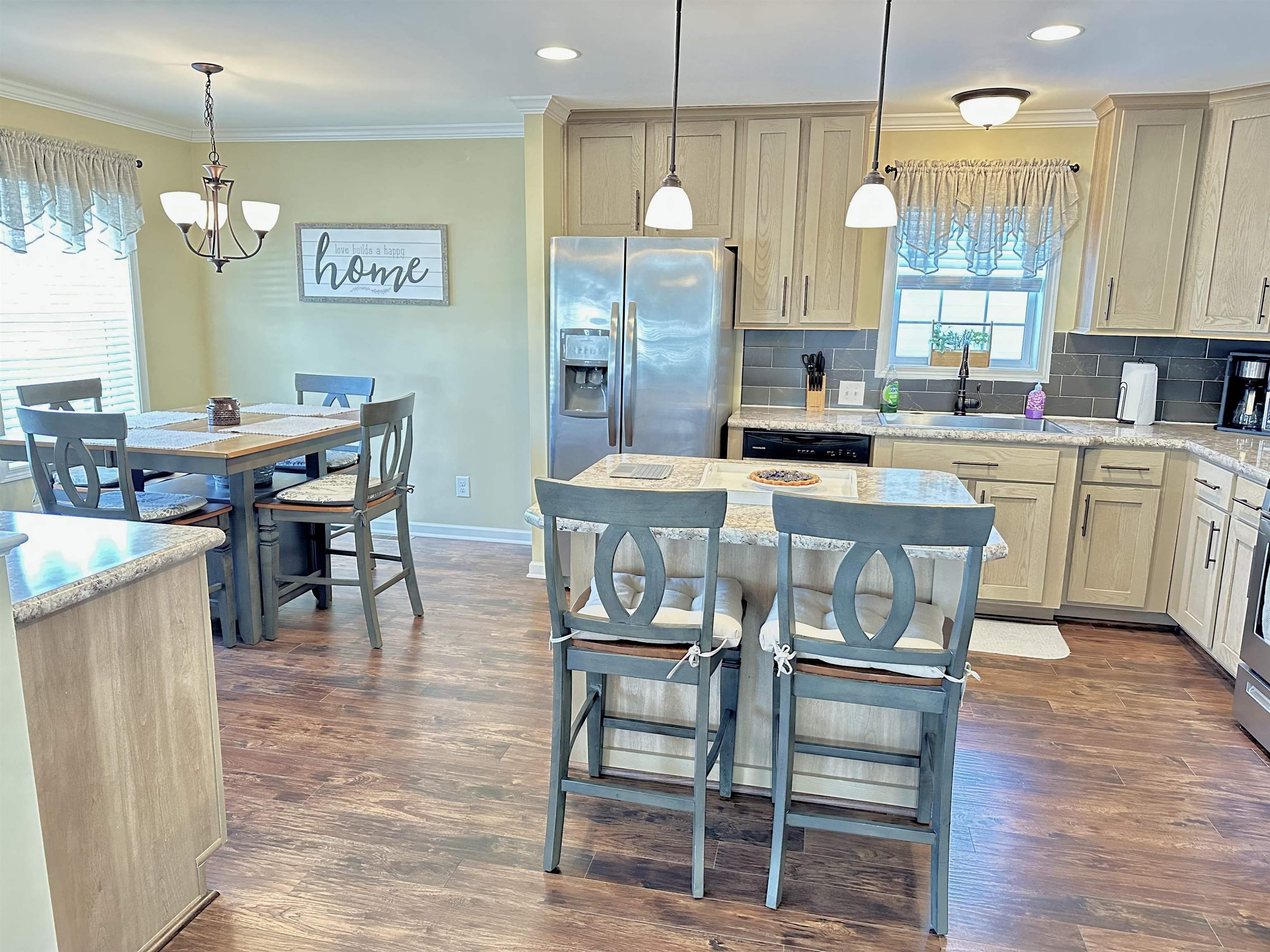2058 Shore Road Seaville, NJ 08230 - Photo 15 of 36 a kitchen with stainless steel appliances granite countertop a table chairs and a refrigerator
