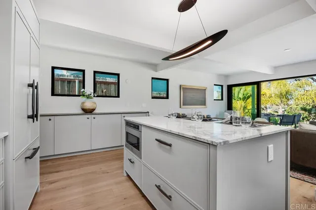 a kitchen with a stove a sink and a refrigerator