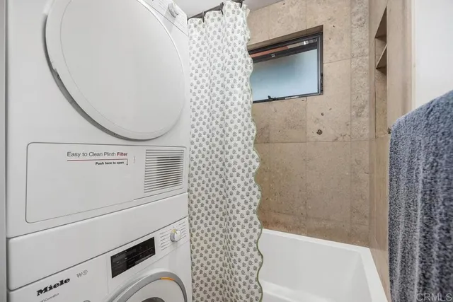 a bathroom with a bathtub and shower