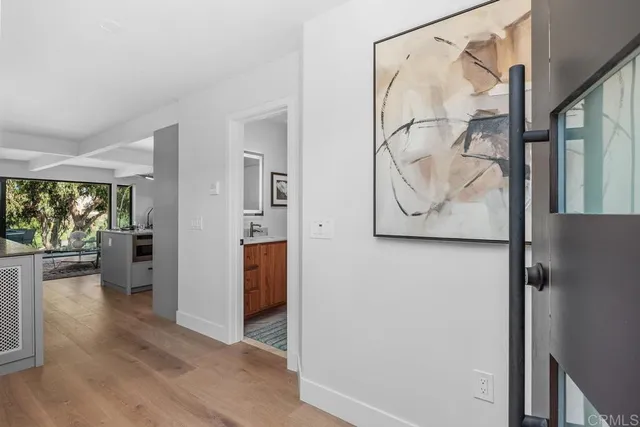 a view of an entryway with wooden floor