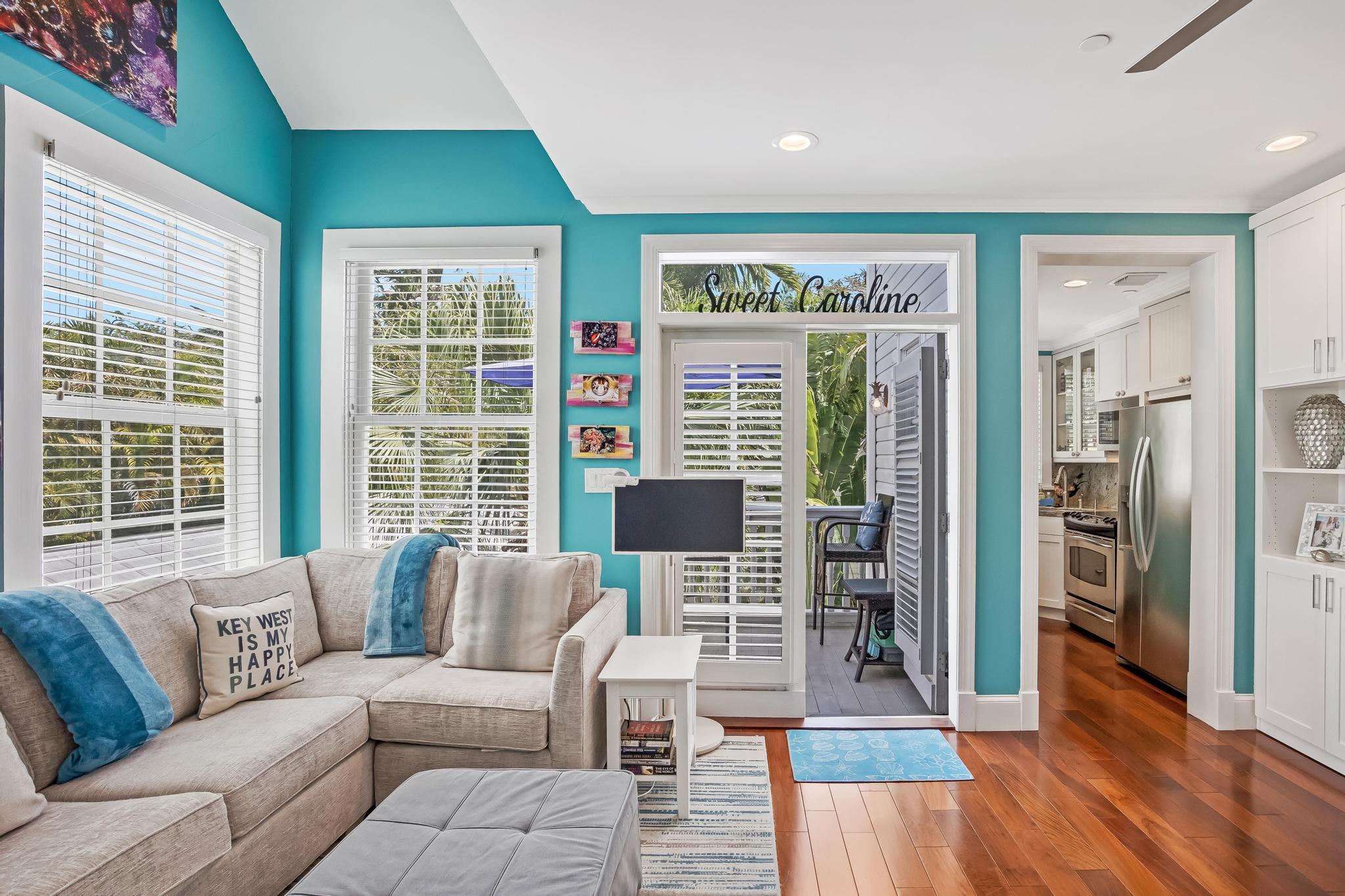 616 Caroline Street, Unit 5 Key West, FL 33040 - Photo 11 of 41 a living room with furniture and wooden floor