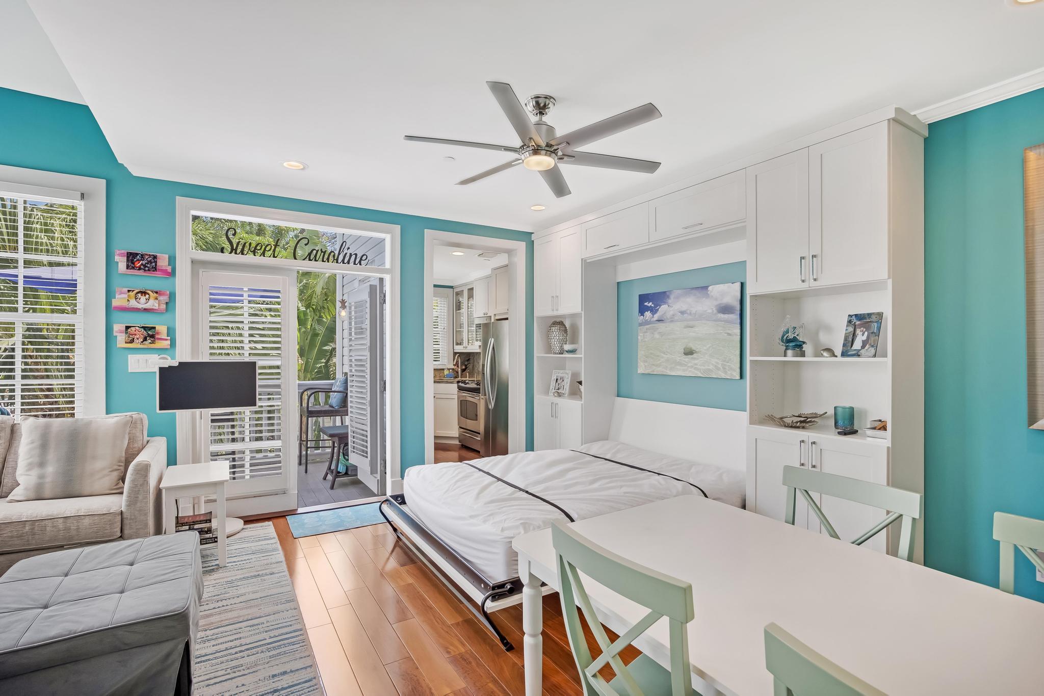 616 Caroline Street, Unit 5 Key West, FL 33040 - Photo 12 of 41 a bed room with a bed and a couch