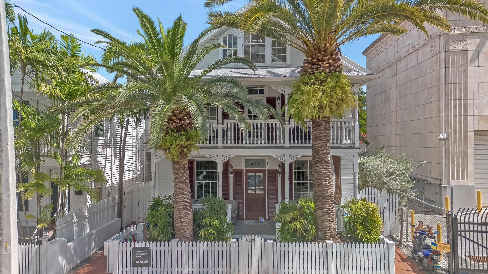 616 Caroline Street, Unit 5 Key West, FL 33040 - Photo 2 of 41 a view of a building with a tree