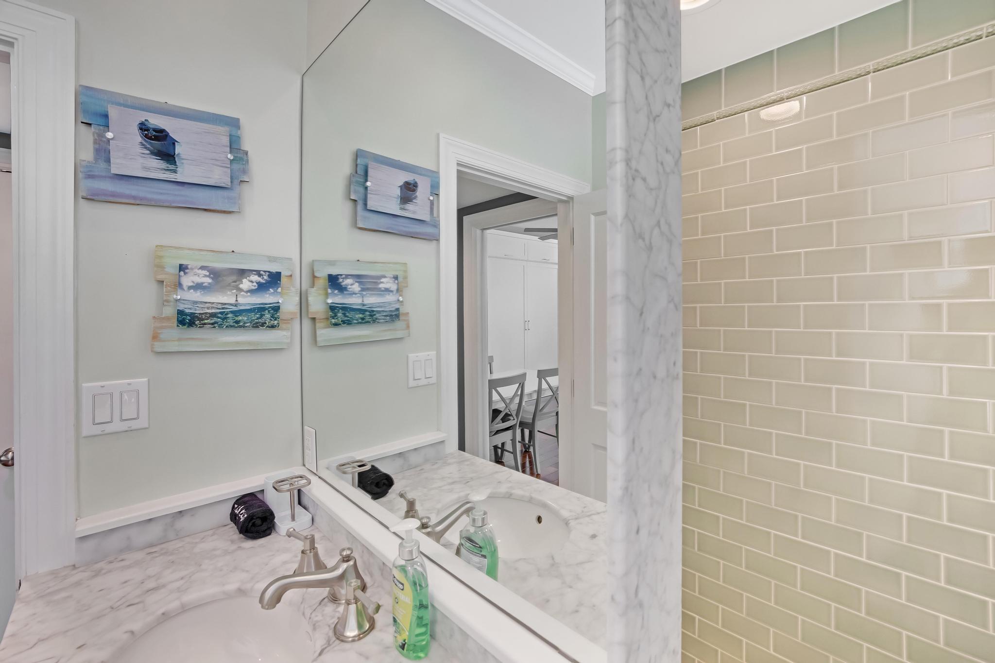 616 Caroline Street, Unit 5 Key West, FL 33040 - Photo 22 of 41 a bathroom with a tub sink and mirror