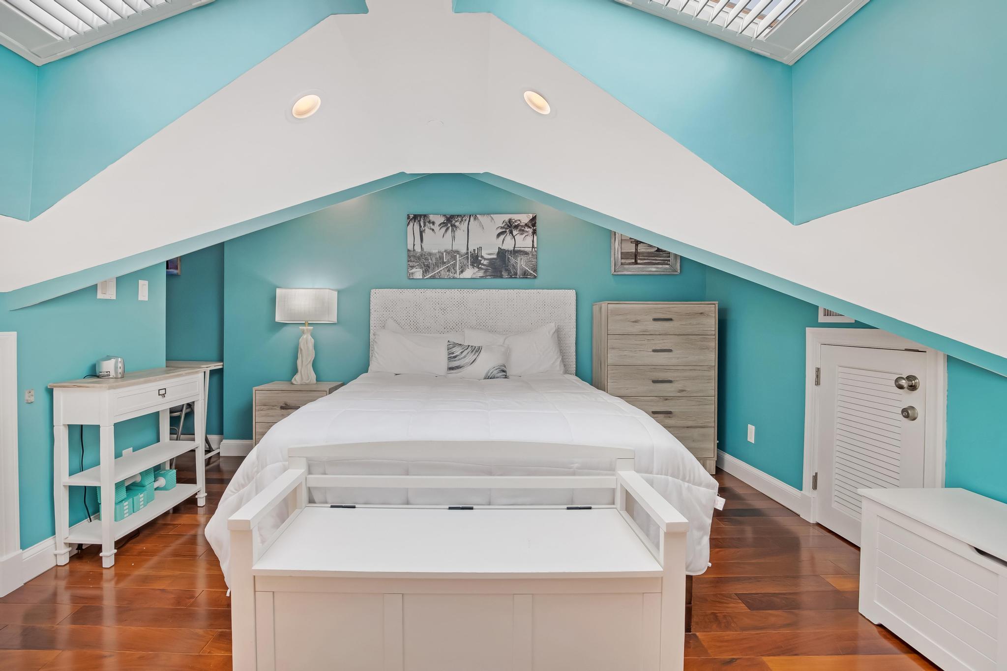 616 Caroline Street, Unit 5 Key West, FL 33040 - Photo 29 of 41 a bedroom with a bed and a cabinets