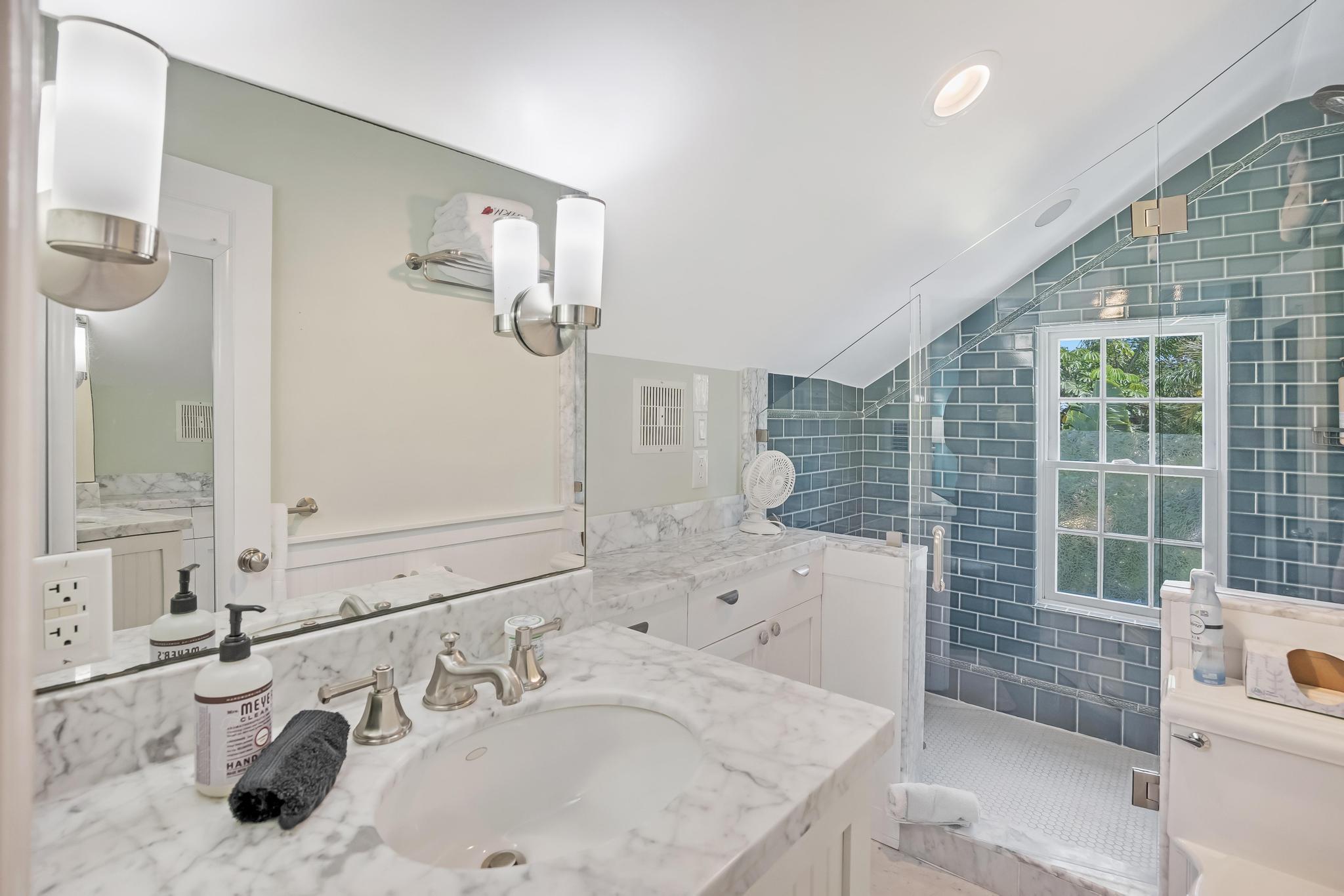 616 Caroline Street, Unit 5 Key West, FL 33040 - Photo 33 of 41 a bathroom with a sink and a mirror