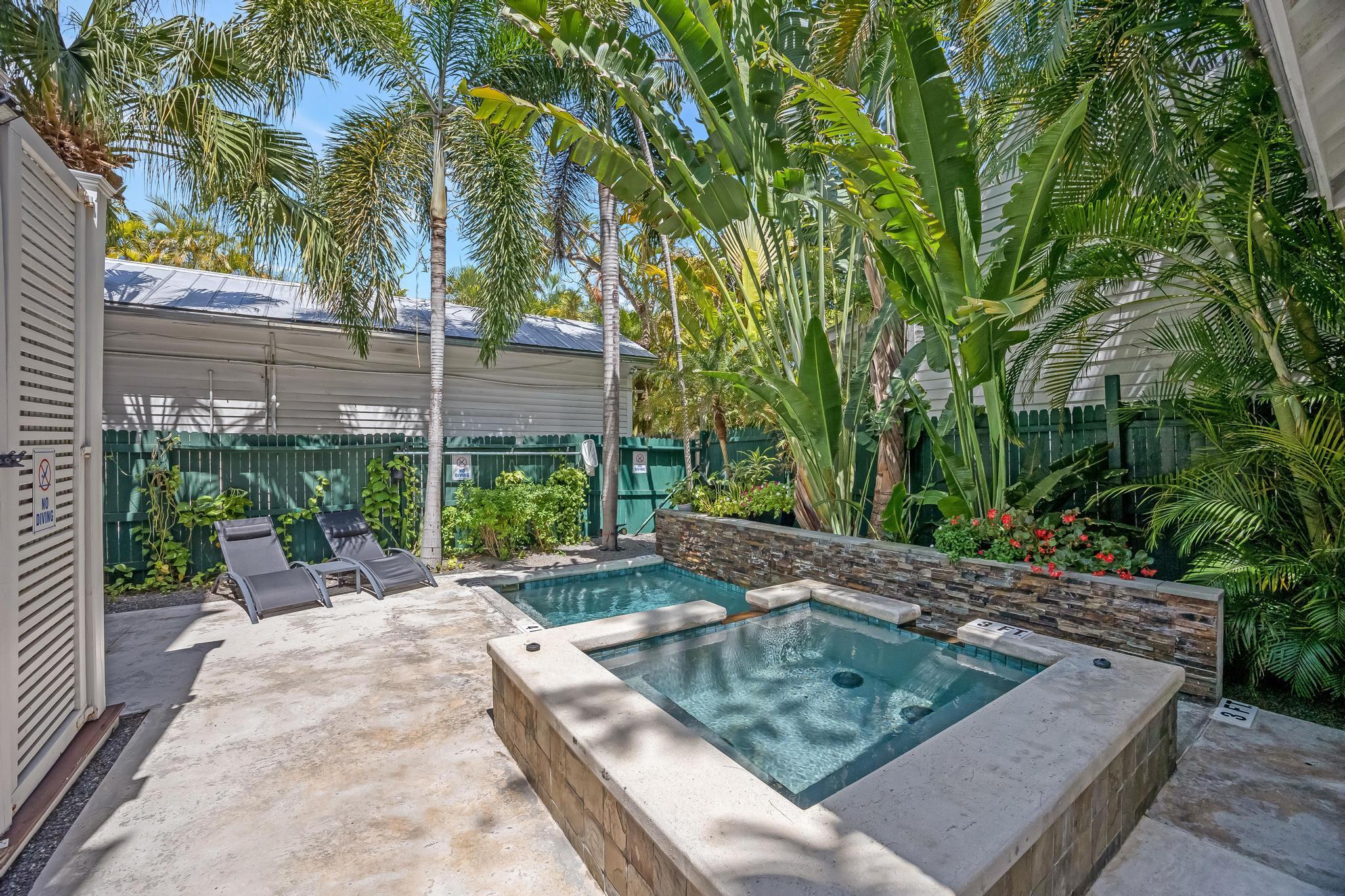 616 Caroline Street, Unit 5 Key West, FL 33040 - Photo 36 of 41 a view of a house with backyard and sitting area
