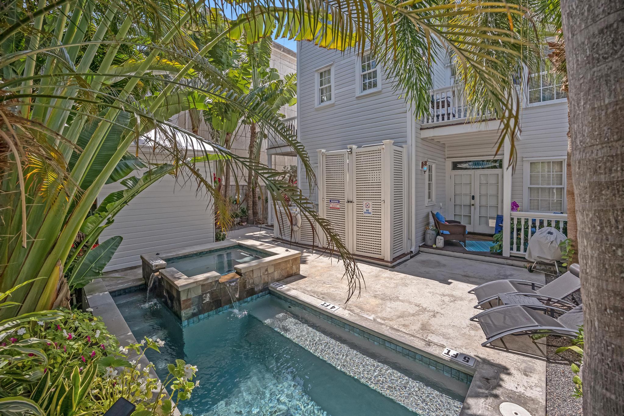 616 Caroline Street, Unit 5 Key West, FL 33040 - Photo 37 of 41 a view of house with backyard and sitting area