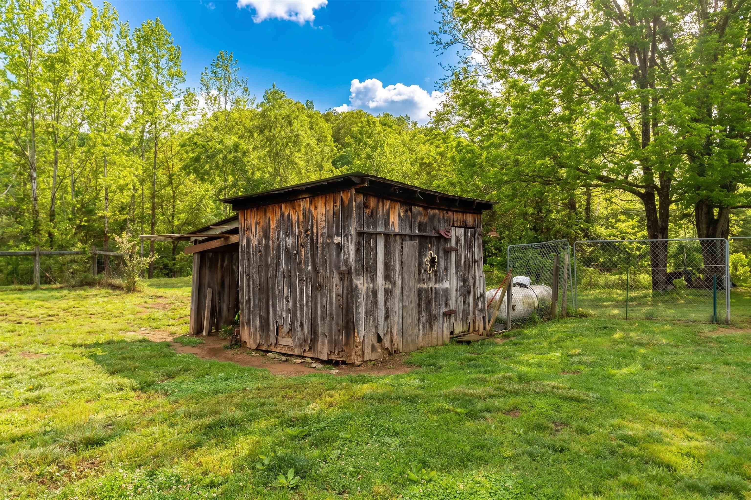 3292 Deerfield Valley Road Deerfield, VA 24432 - Photo 52 of 69 a view of a wooden house with a yard