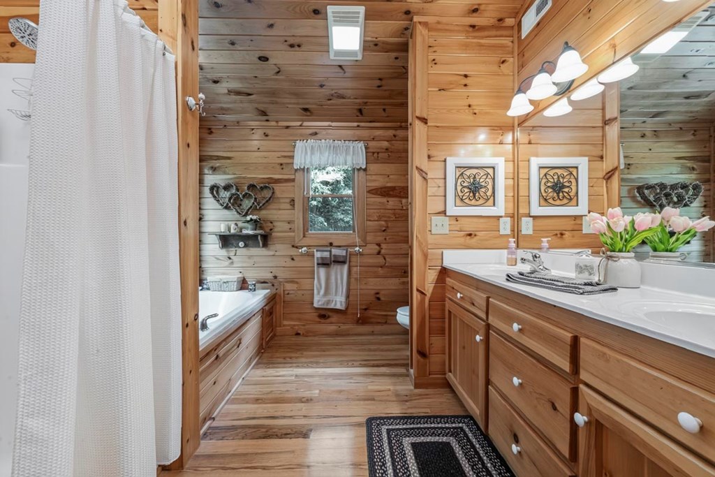 115 Lakota Trail Blue Ridge, GA 30513 - Photo 24 of 49 a bathroom with sink shower and mirror