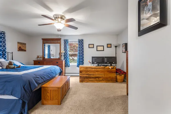 a bed room with furniture and a chandelier