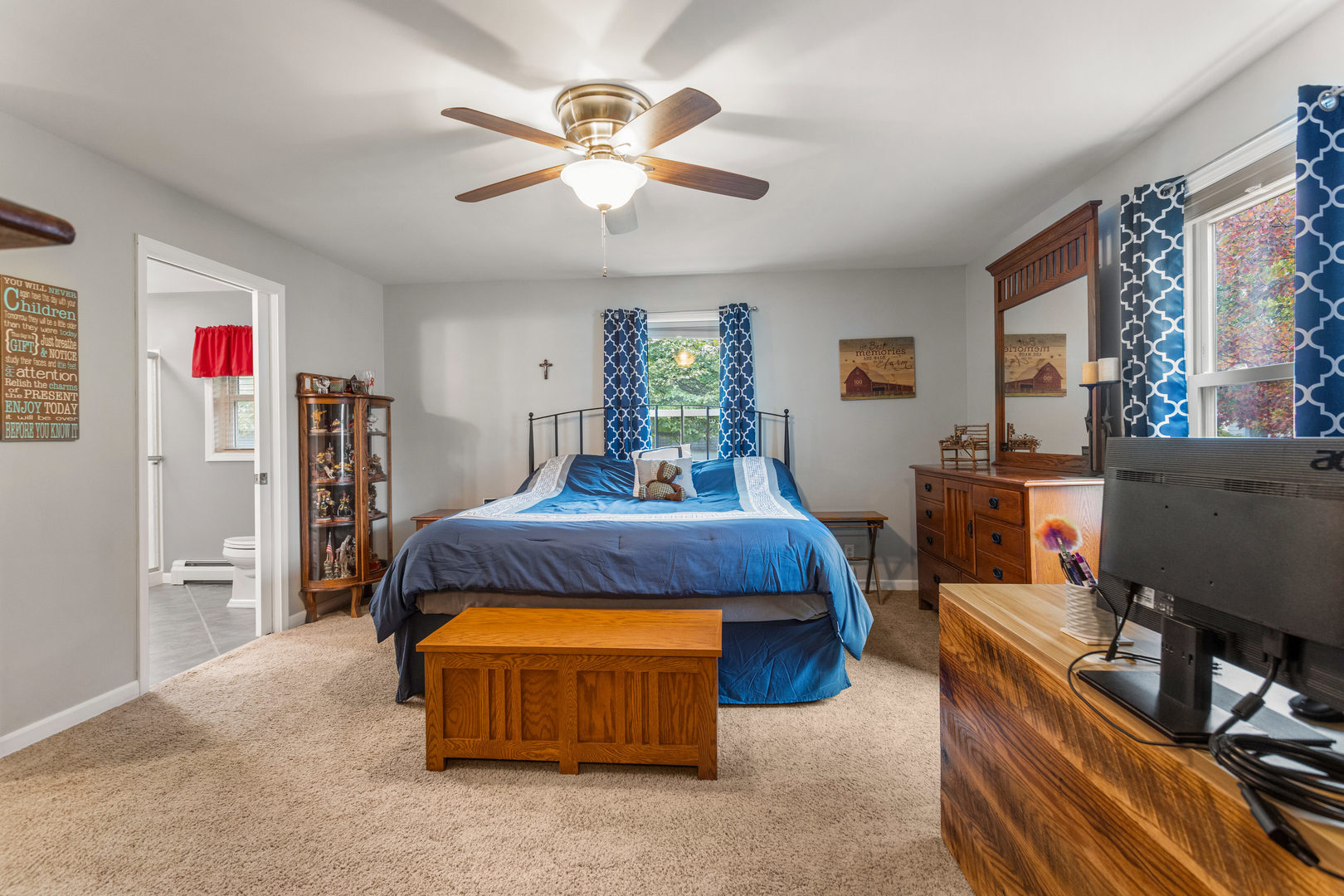 110 5th Street Ivesdale, IL 61851 - Photo 15 of 37 a spacious bedroom with a bed and a flat screen tv