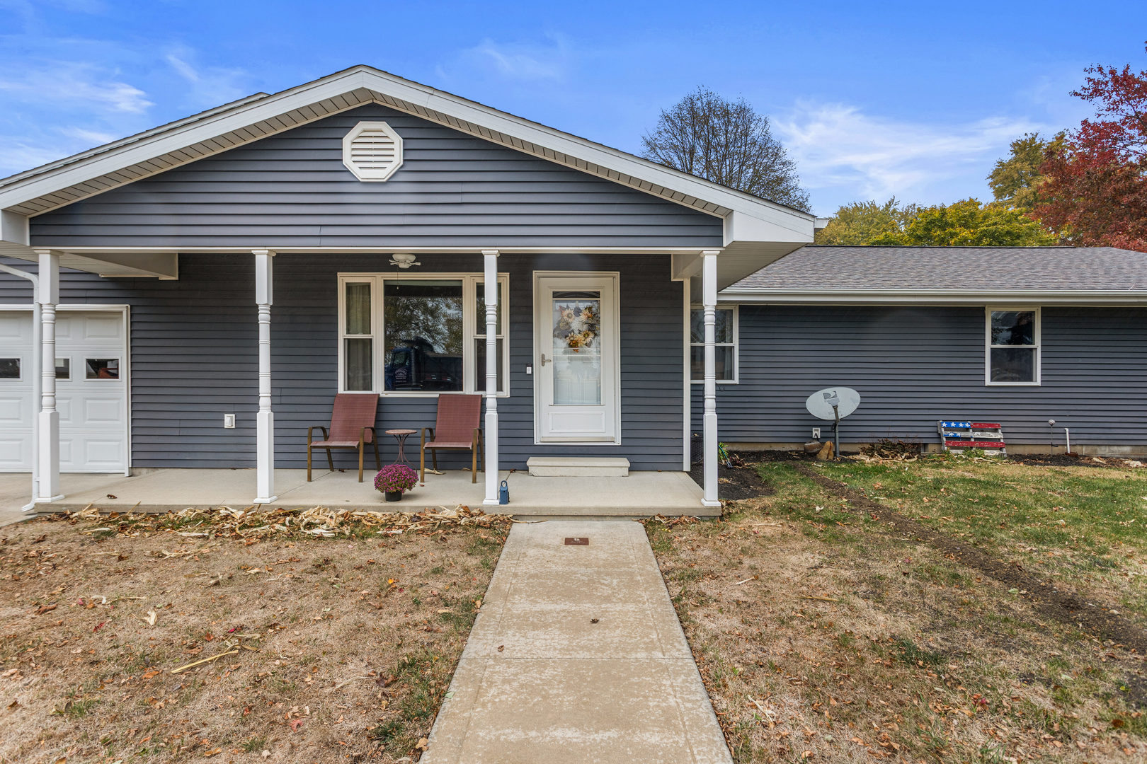 110 5th Street Ivesdale, IL 61851 - Photo 4 of 37 a front view of a house with garden
