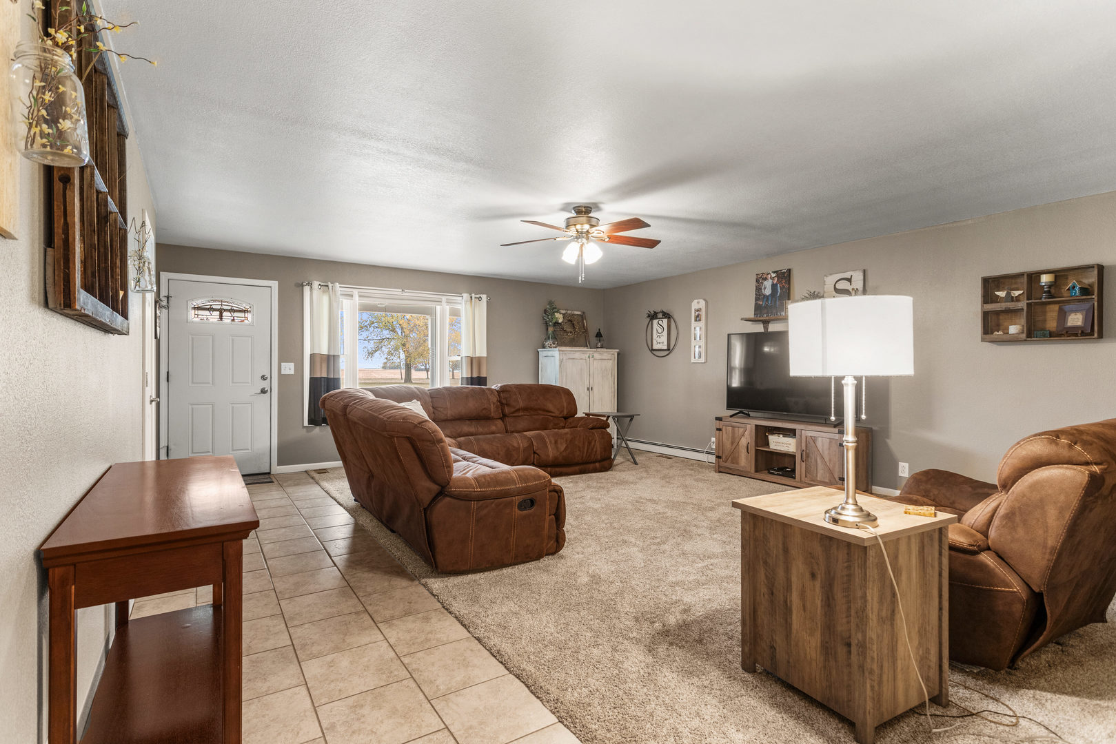 110 5th Street Ivesdale, IL 61851 - Photo 6 of 37 a living room with furniture and a flat screen tv