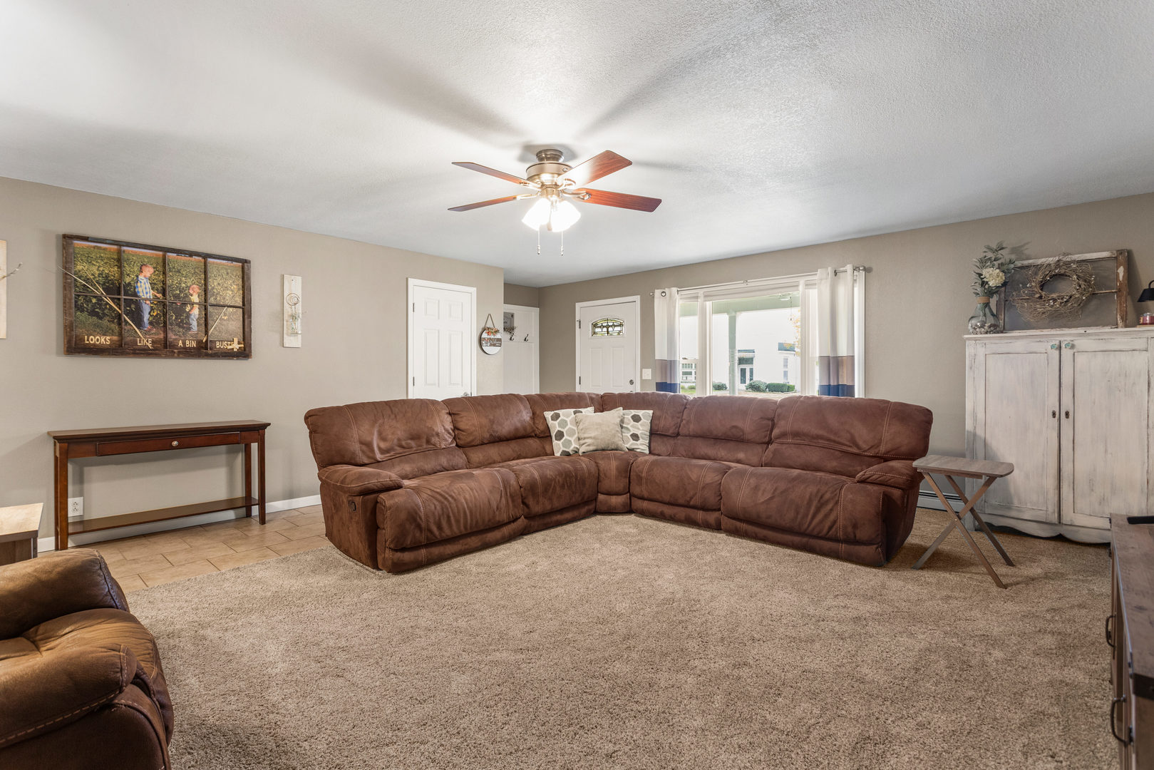 110 5th Street Ivesdale, IL 61851 - Photo 7 of 37 a living room with furniture and a ceiling fan