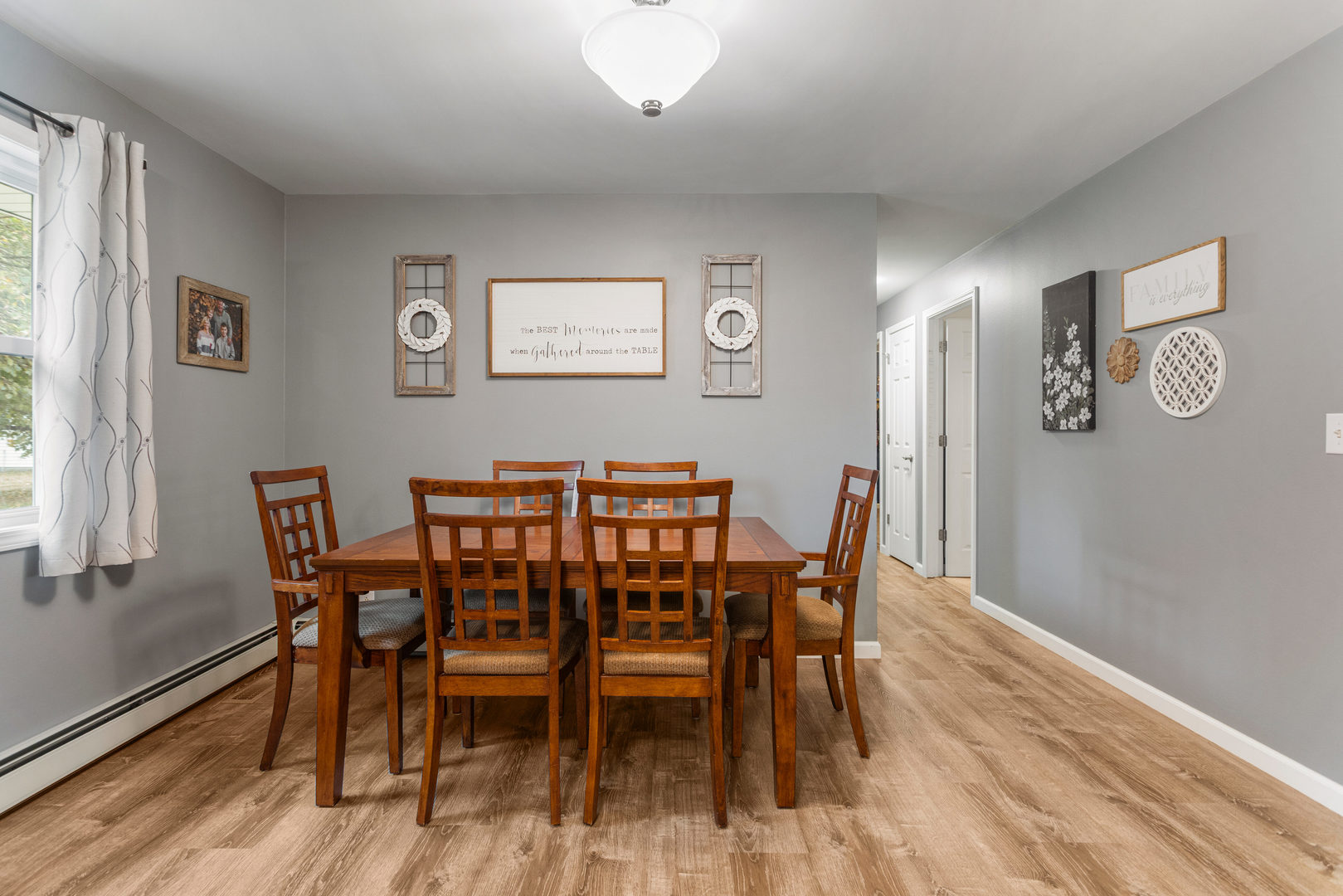 110 5th Street Ivesdale, IL 61851 - Photo 8 of 37 a view of a dining room with furniture and wooden floor