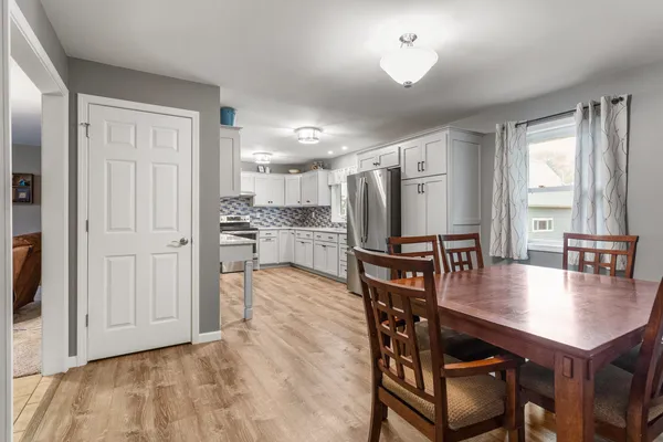 a dining room with furniture and window