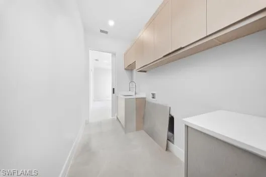 a view of storage and utility room with washer and dryer