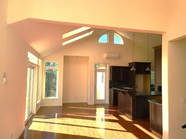 a view of living room with furniture and floor to ceiling windows