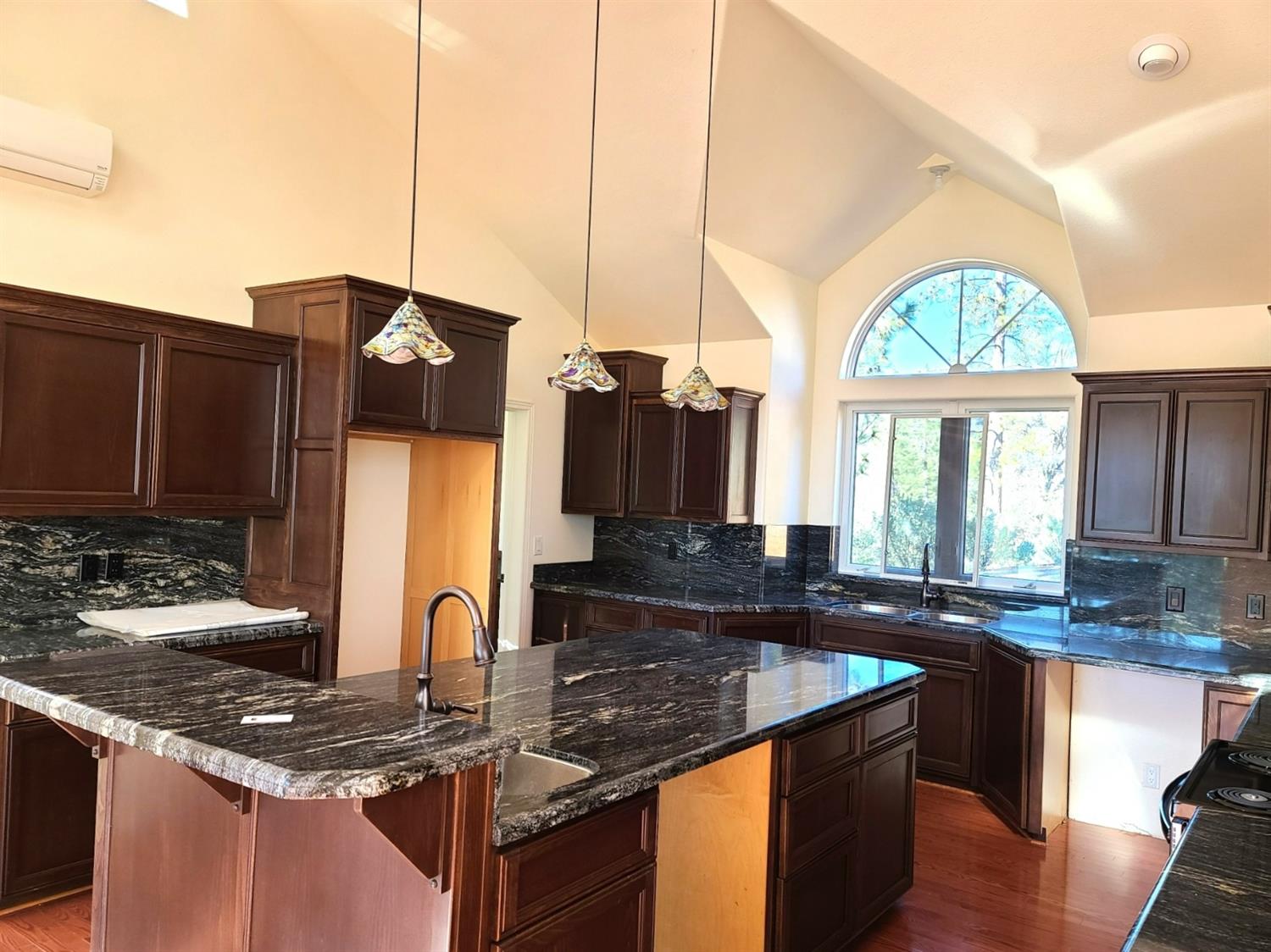 2805 Mason Road Rail Road Flat, CA 95248 - Photo 19 of 75 a kitchen with kitchen island granite countertop a sink a counter top space and cabinets