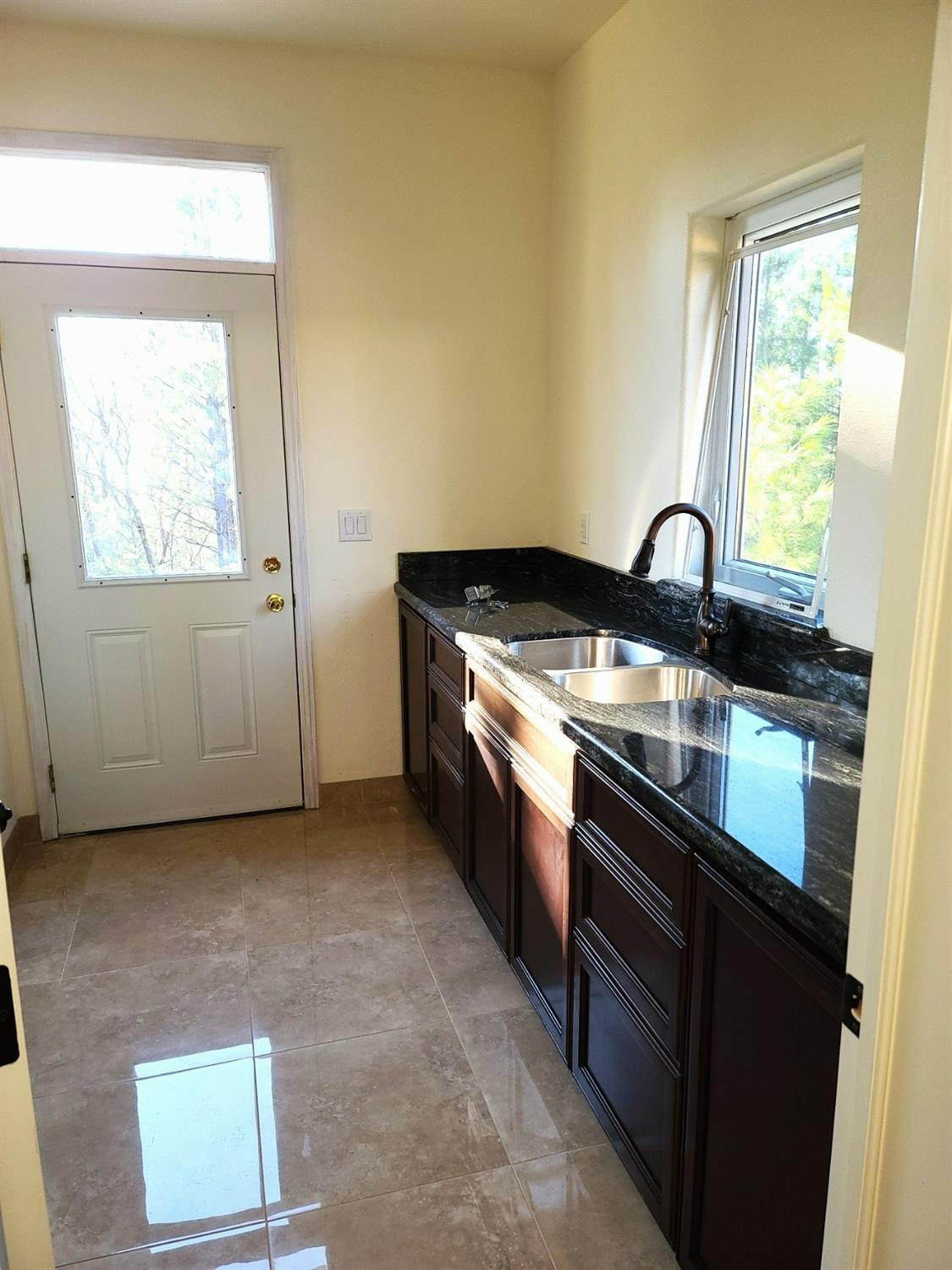 2805 Mason Road Rail Road Flat, CA 95248 - Photo 23 of 75 a kitchen with stainless steel appliances granite countertop a stove a sink and a microwave