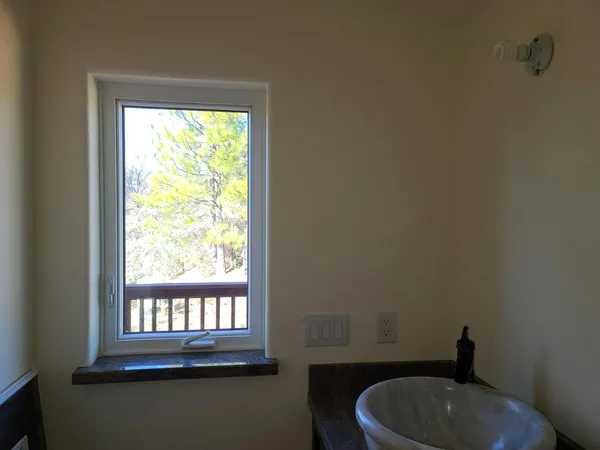 a view of deck with wooden floor and fence