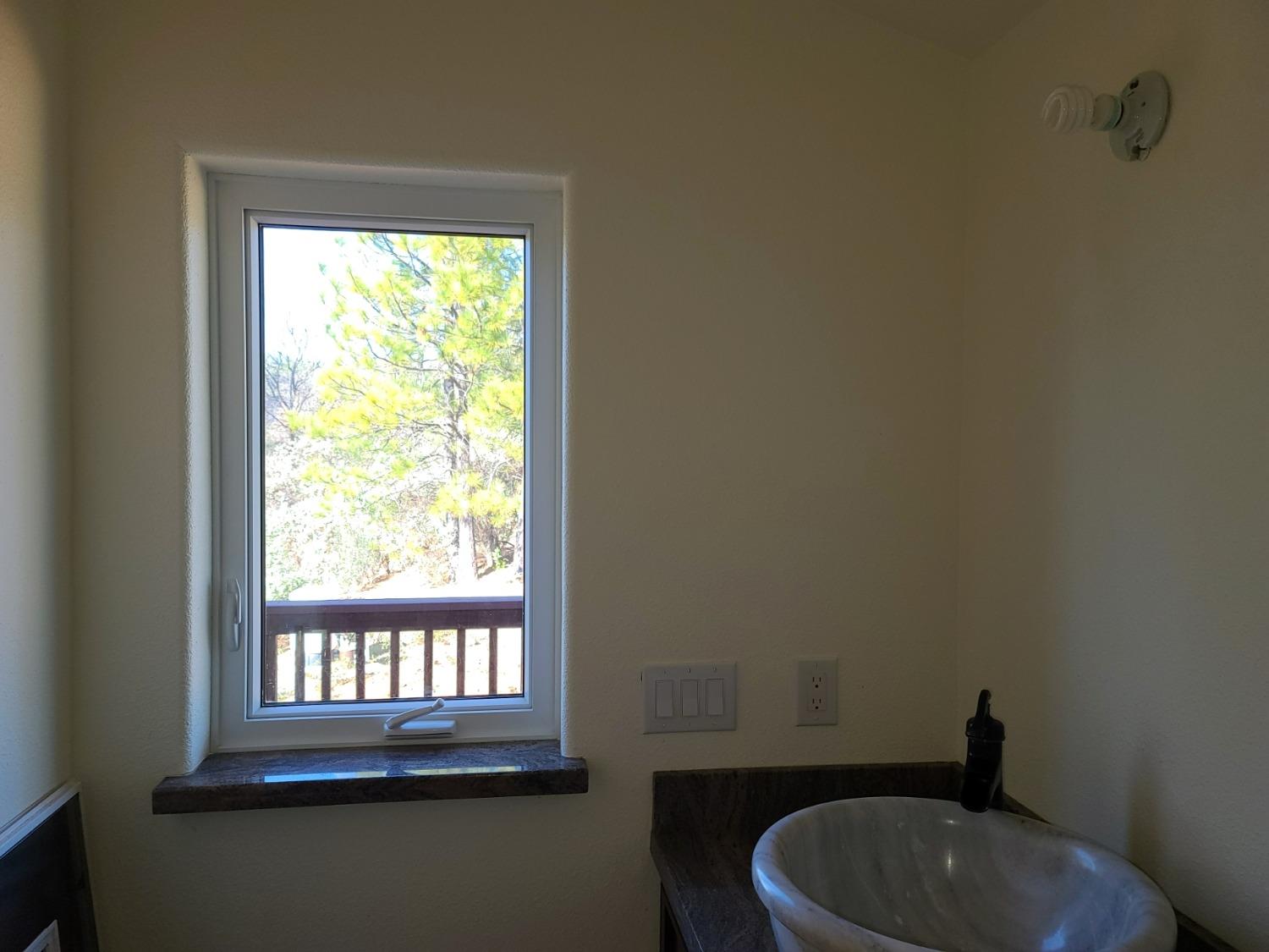 2805 Mason Road Rail Road Flat, CA 95248 - Photo 27 of 75 a bathroom with a toilet sink and window