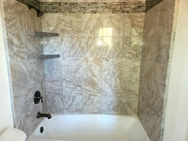 a view of a small space with wooden floor