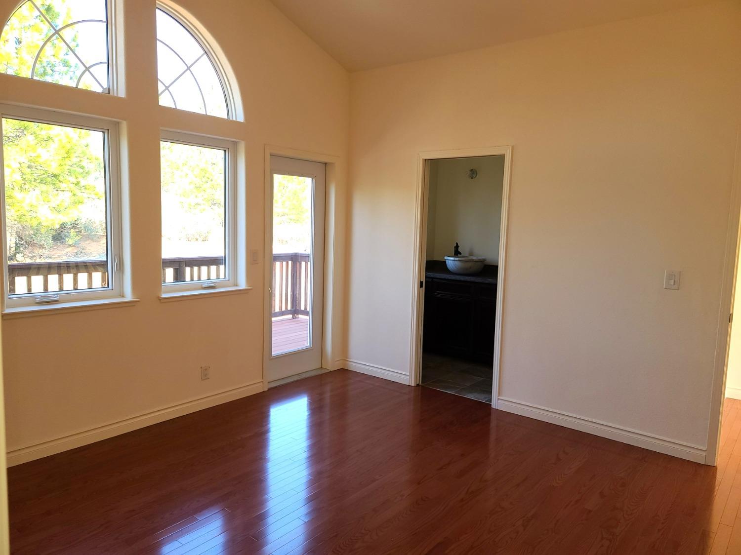 2805 Mason Road Rail Road Flat, CA 95248 - Photo 34 of 75 a view of an empty room with wooden floor and a window