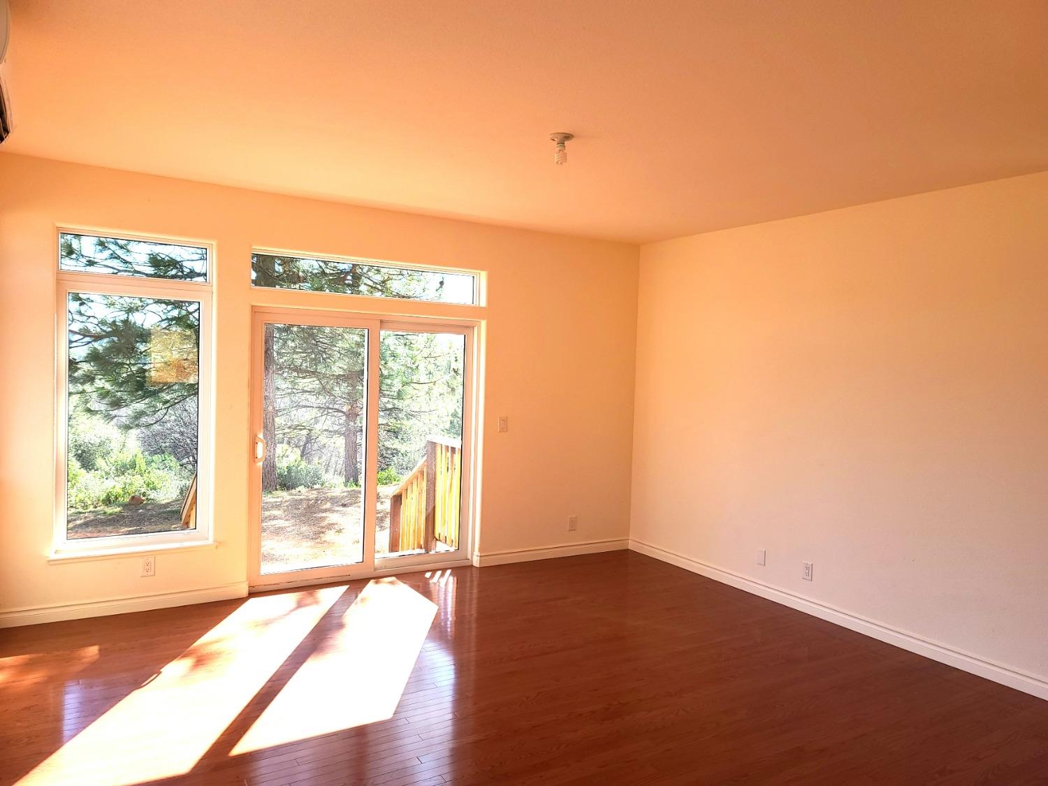 2805 Mason Road Rail Road Flat, CA 95248 - Photo 45 of 75 a view of an empty room with wooden floor and a window