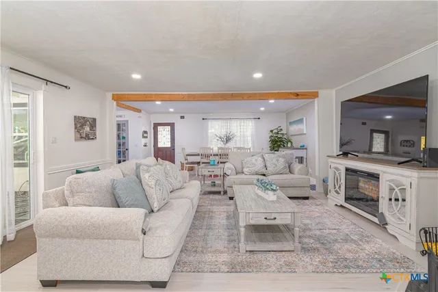 a bedroom with a bed and a rug