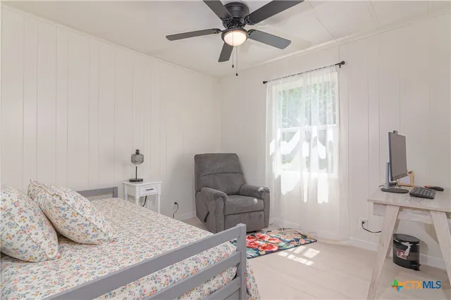 a view of washer and dryer with kitchen in the background