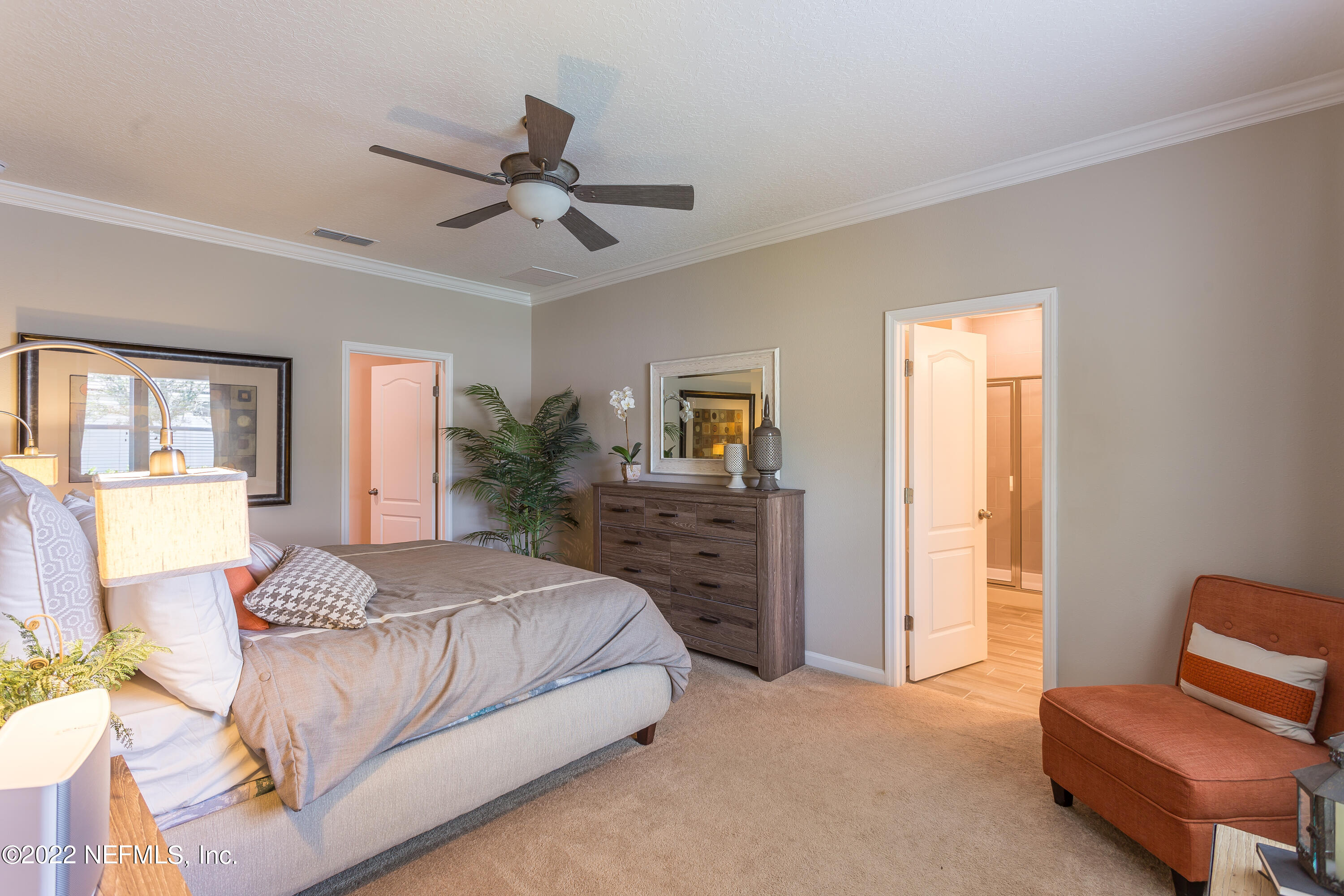 130 White Rabbit Run St. Augustine, FL 32092 - Photo 8 of 11 a bedroom with a bed and furniture