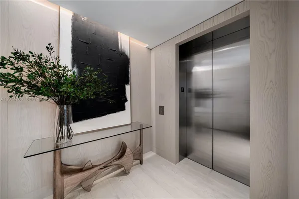 a bathroom with a shower and a plant in it