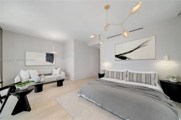 a living room with furniture and floor to ceiling window