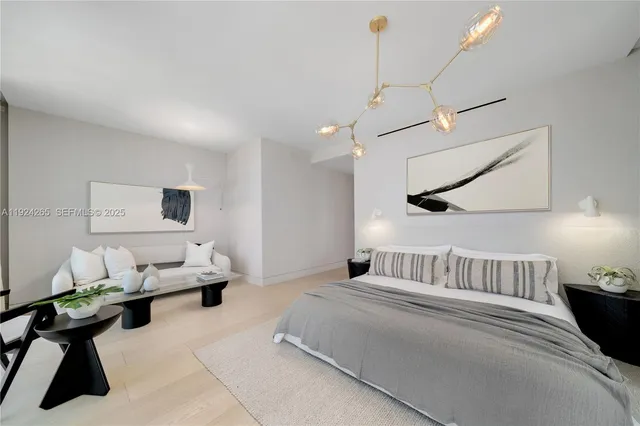 a living room with furniture and floor to ceiling window