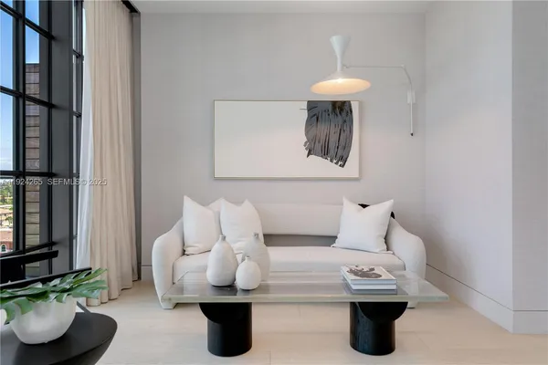 a bed room with a bed and a chandelier