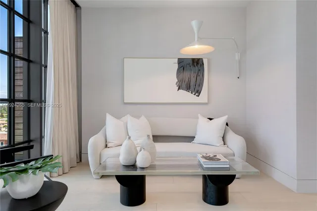 a bed room with a bed and a chandelier