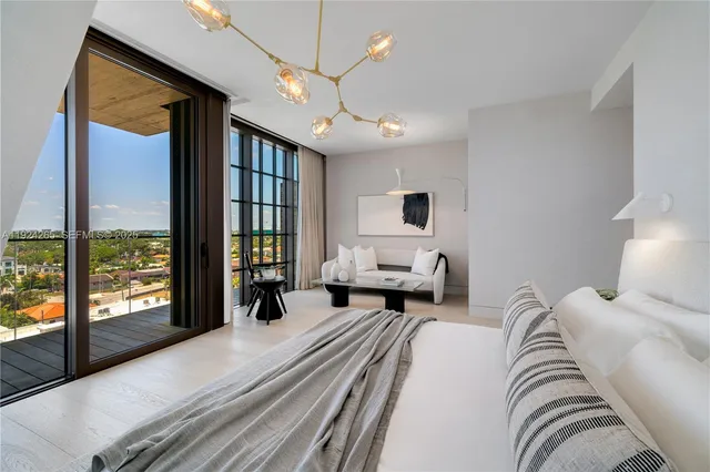 a view of a hallway with wooden floor and entryway