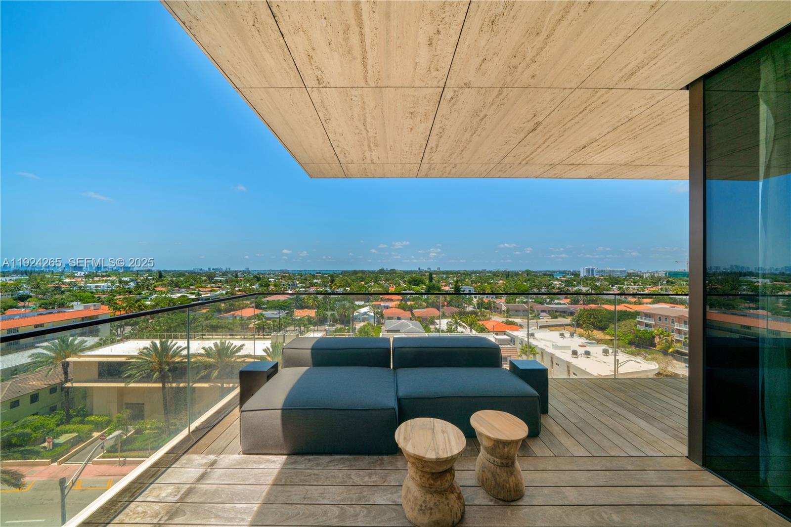8955 Collins Avenue, Unit 702 Surfside, FL 33154 - Photo 43 of 56 a view of a swimming pool and an outdoor seating