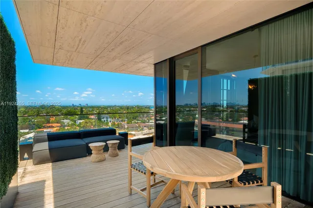 a view of a field with an ocean