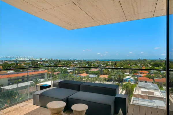 a view of a balcony with chairs