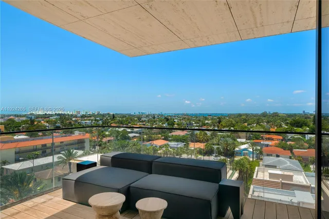 a view of a balcony with chairs