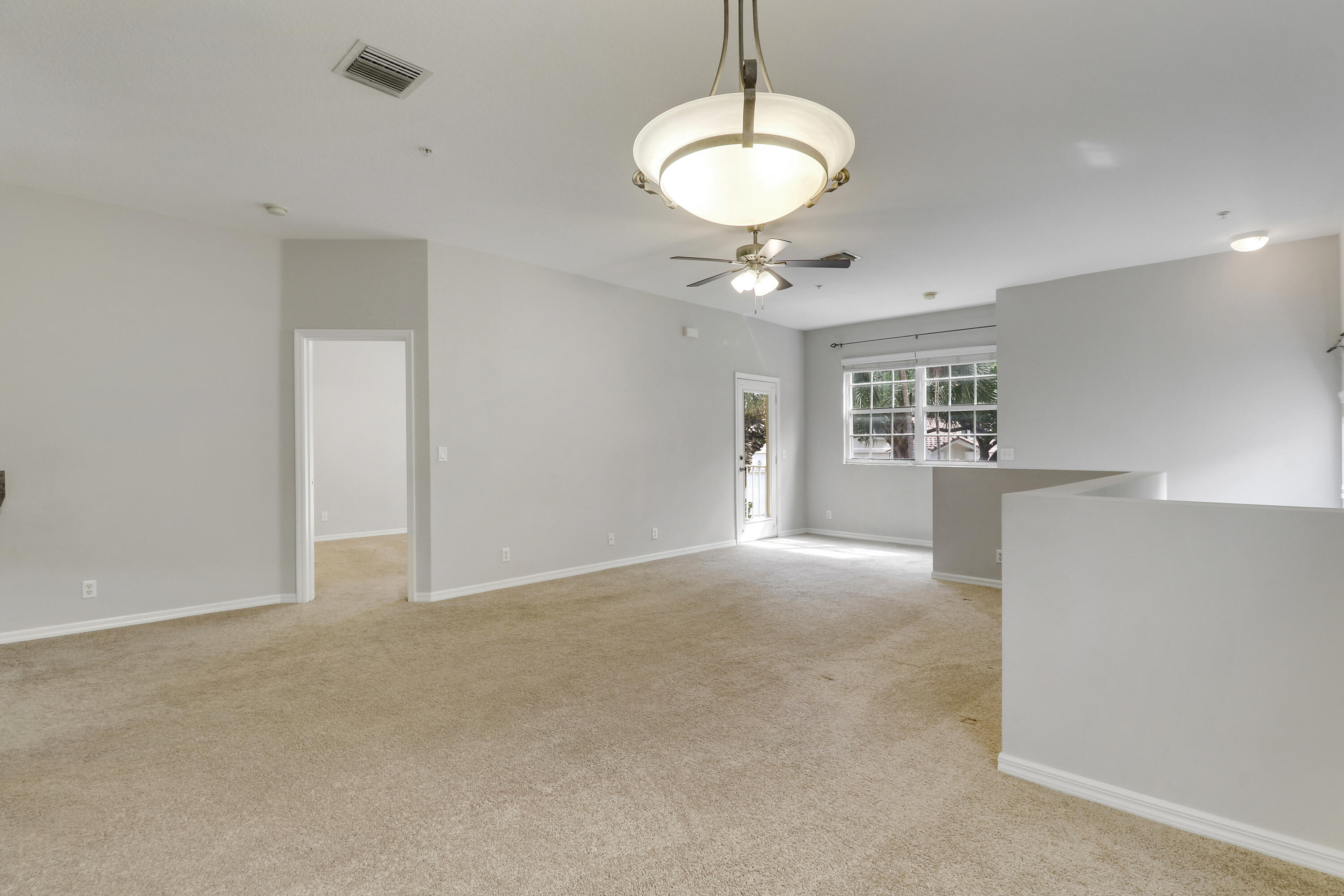 104 Lighthouse Circle, Unit H2 Tequesta, FL 33469 - Photo 18 of 45 a view of an empty room with a window