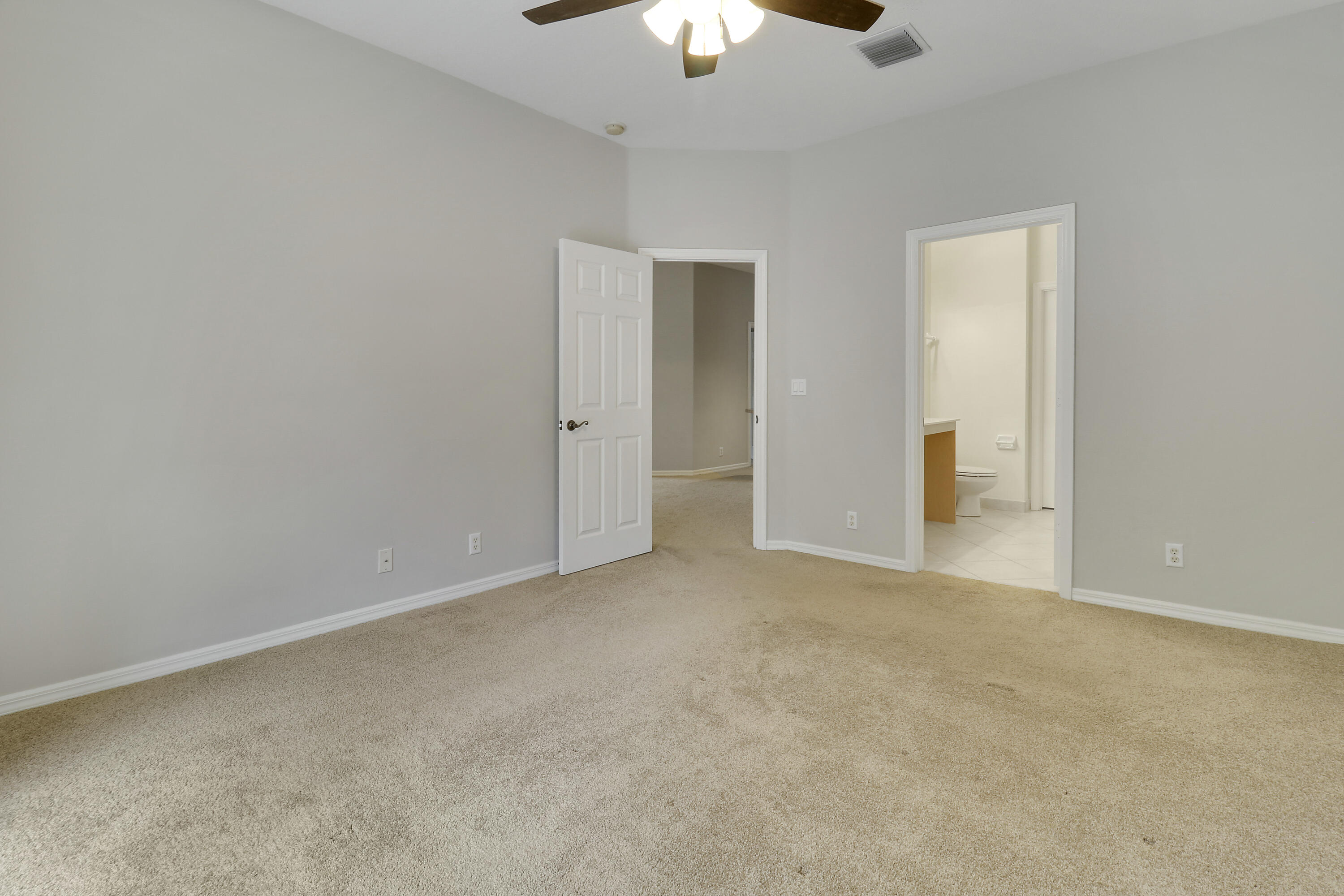 104 Lighthouse Circle, Unit H2 Tequesta, FL 33469 - Photo 20 of 45 a view of an empty room and chandelier fan