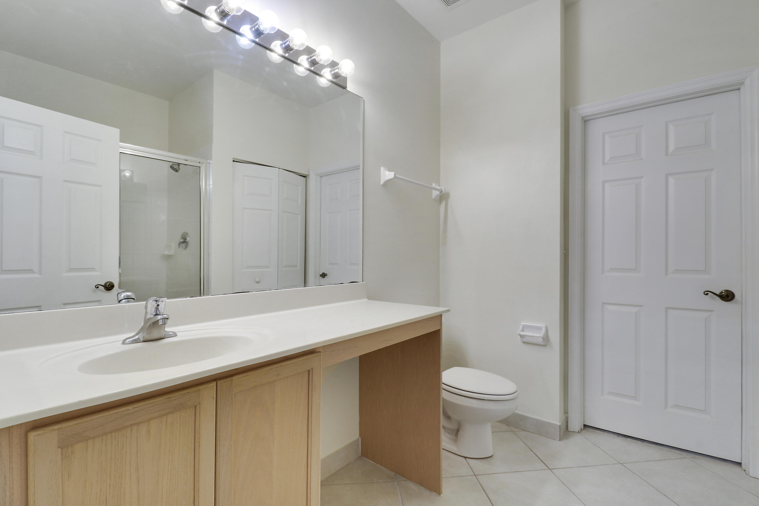 104 Lighthouse Circle, Unit H2 Tequesta, FL 33469 - Photo 21 of 45 a bathroom with a sink toilet and shower