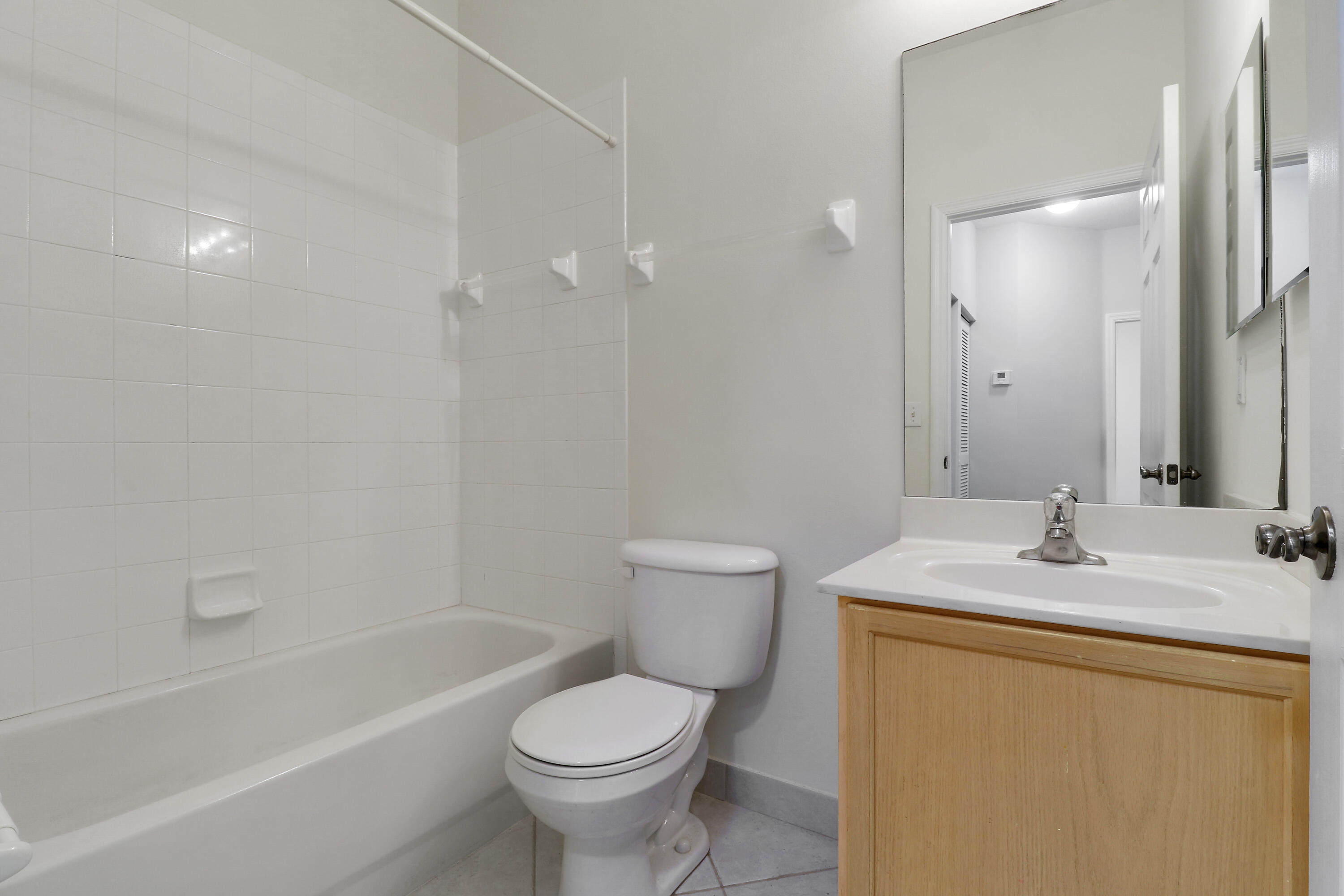 104 Lighthouse Circle, Unit H2 Tequesta, FL 33469 - Photo 25 of 45 a bathroom with a sink toilet and shower
