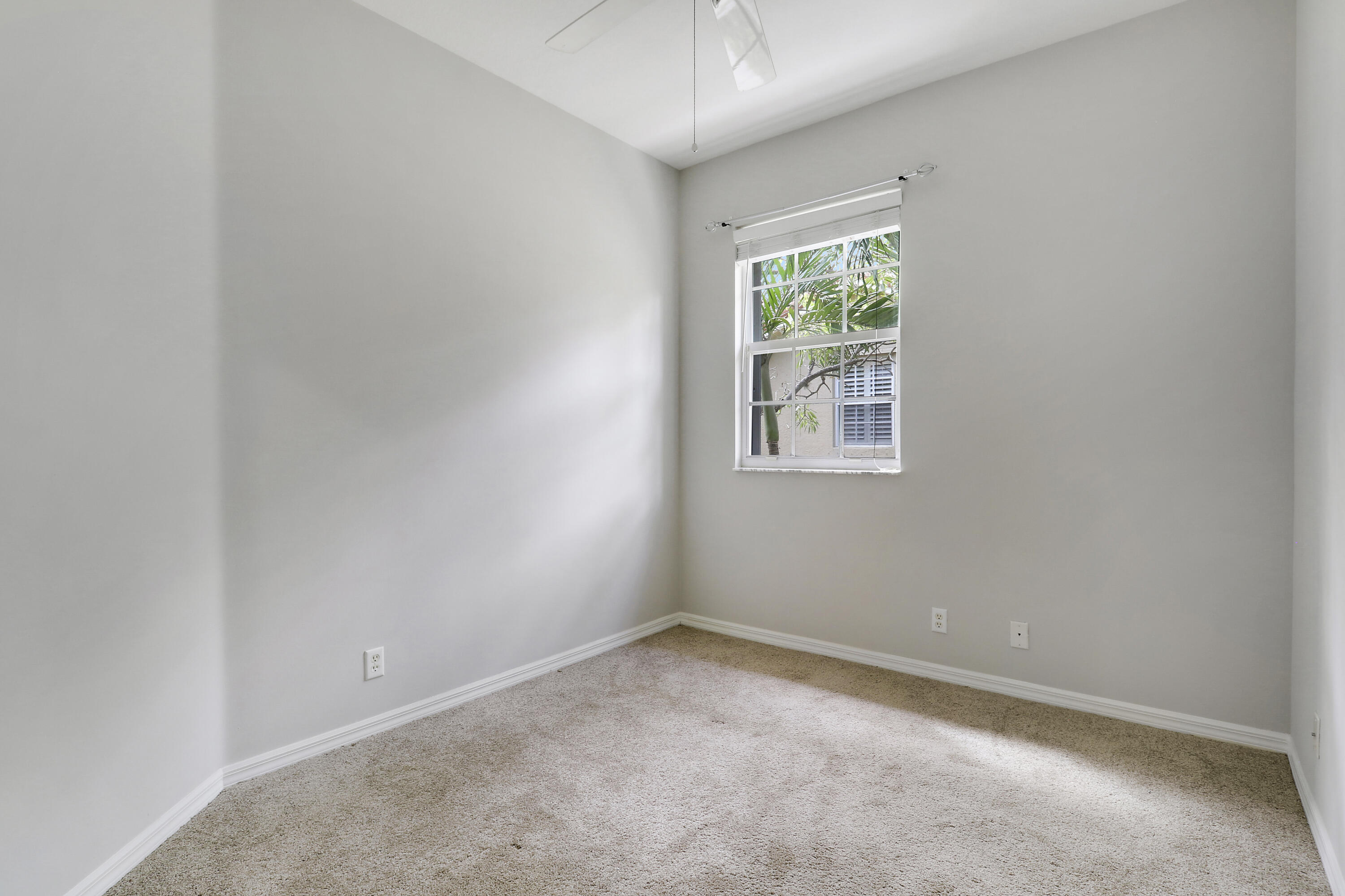 104 Lighthouse Circle, Unit H2 Tequesta, FL 33469 - Photo 26 of 45 an empty room with a window