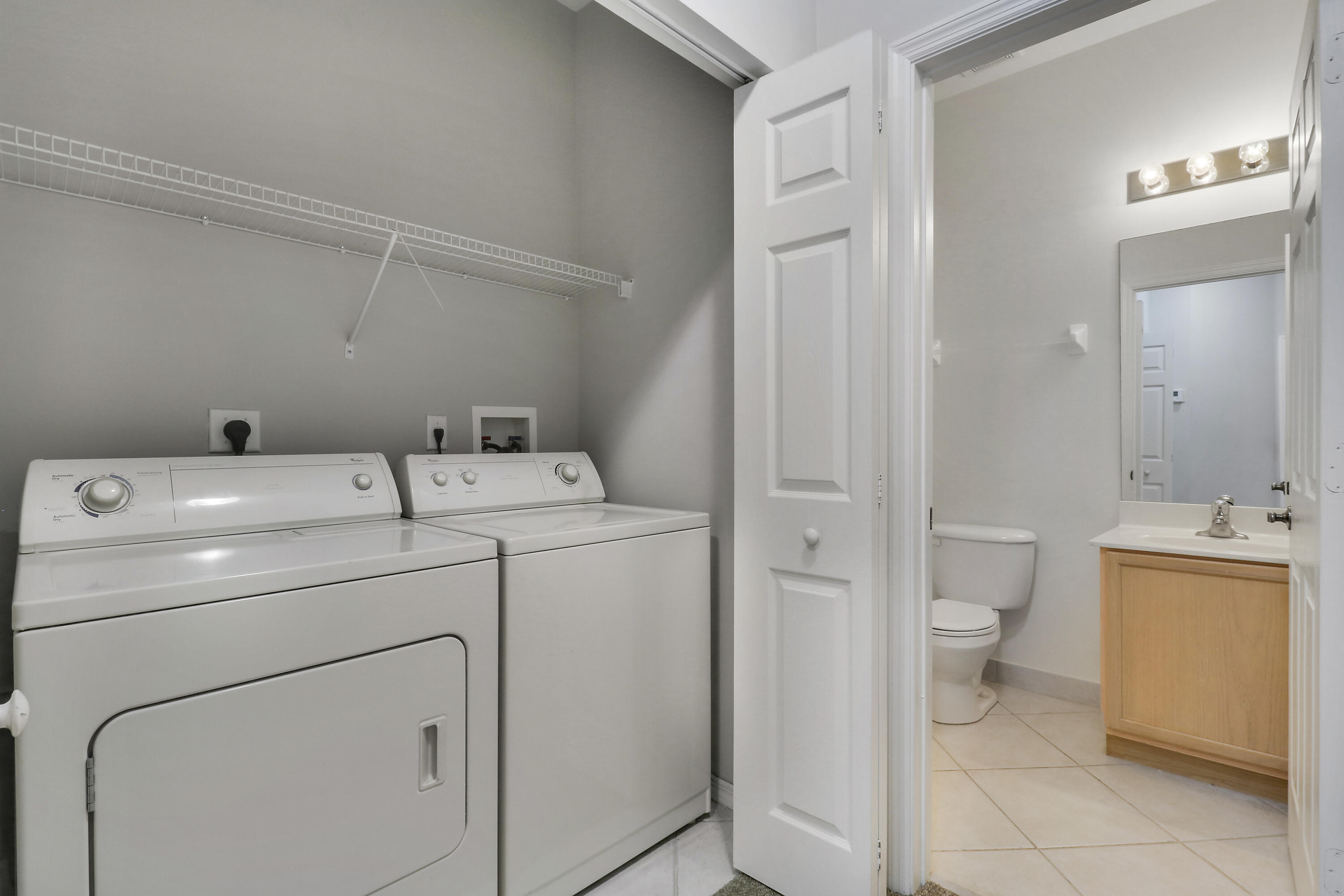 104 Lighthouse Circle, Unit H2 Tequesta, FL 33469 - Photo 28 of 45 a utility room with dryer and washer