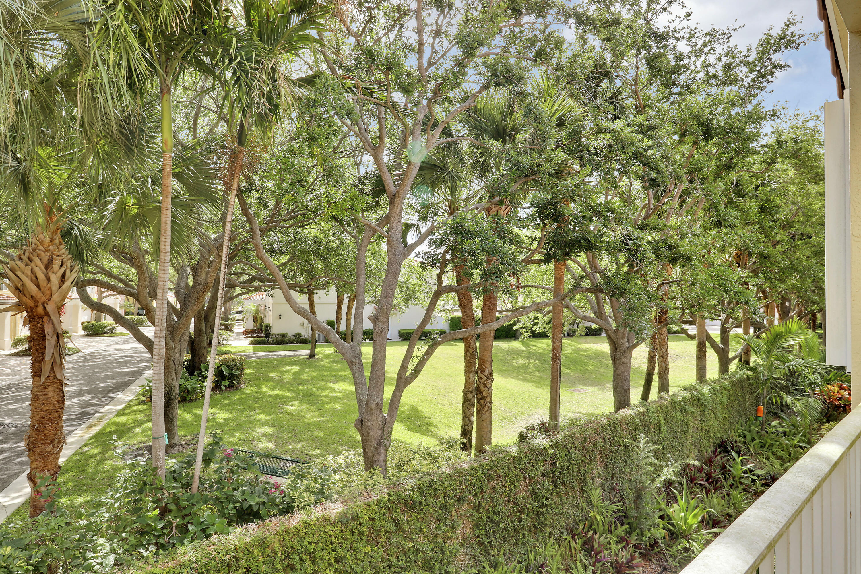 104 Lighthouse Circle, Unit H2 Tequesta, FL 33469 - Photo 31 of 45 a view of yard with large trees